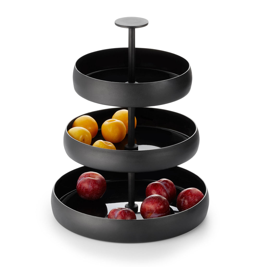 3-tiered black tray with peaches and red apples