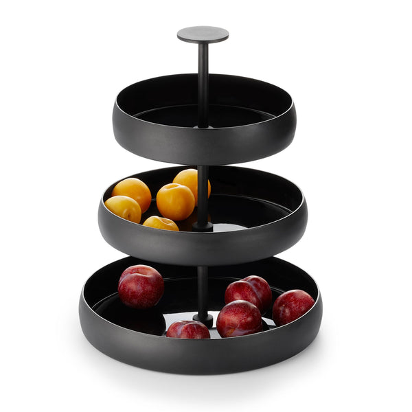 3-tiered black tray with peaches and red apples